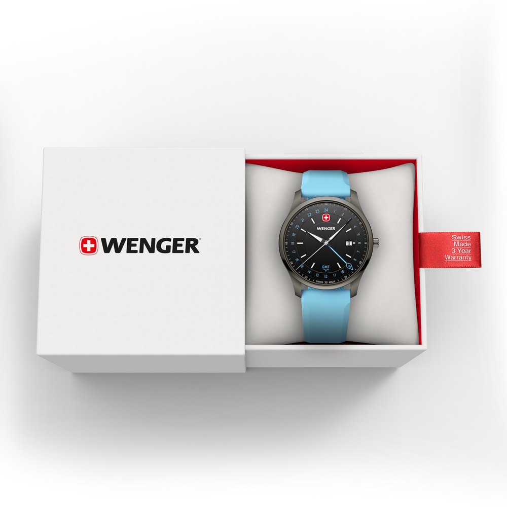 Ein silberner Wenger-Chronograph mit blauem Armband in einer weißen Box mit Garantieanhänger.
