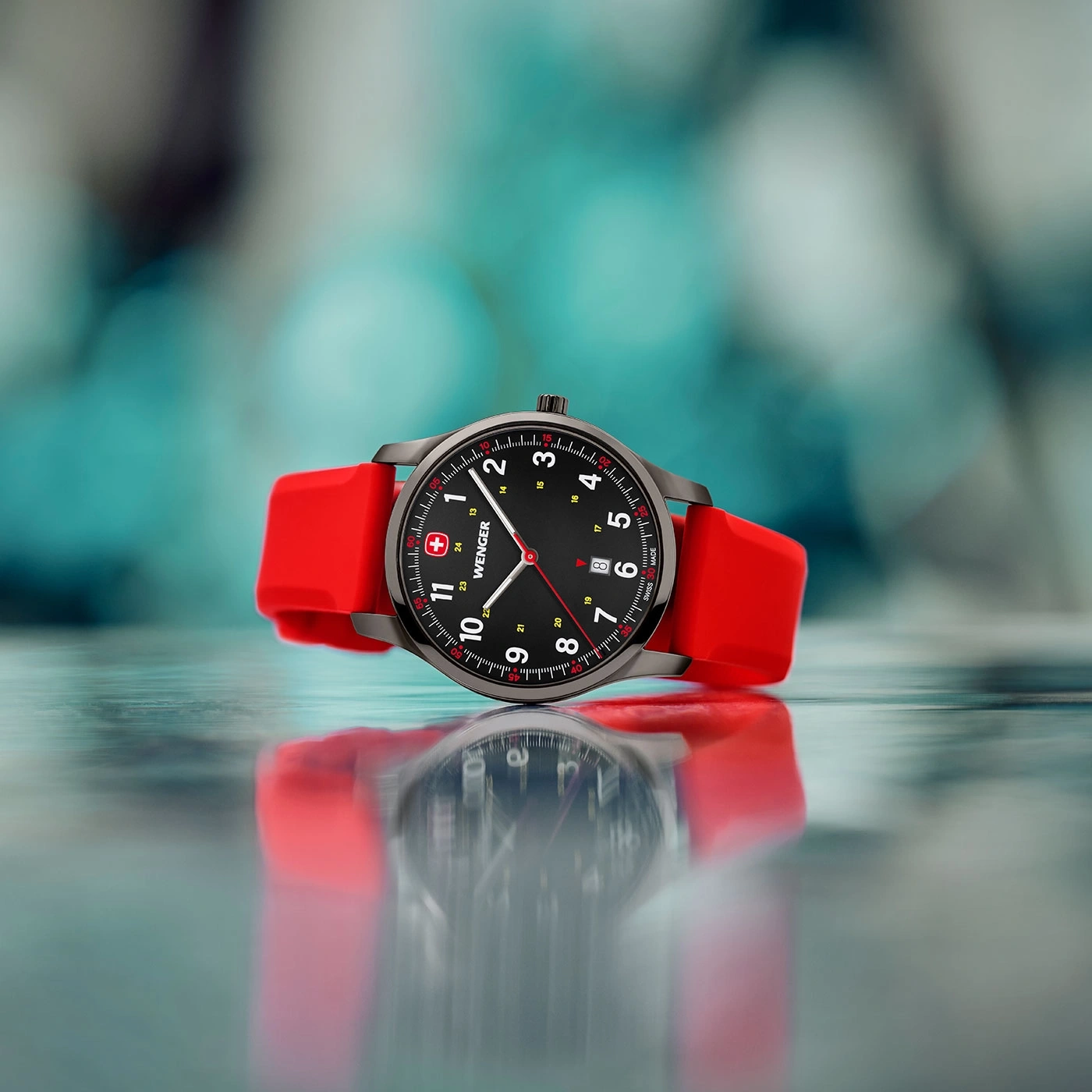 Wenger watch with red strap, black dial, and Swiss cross logo.