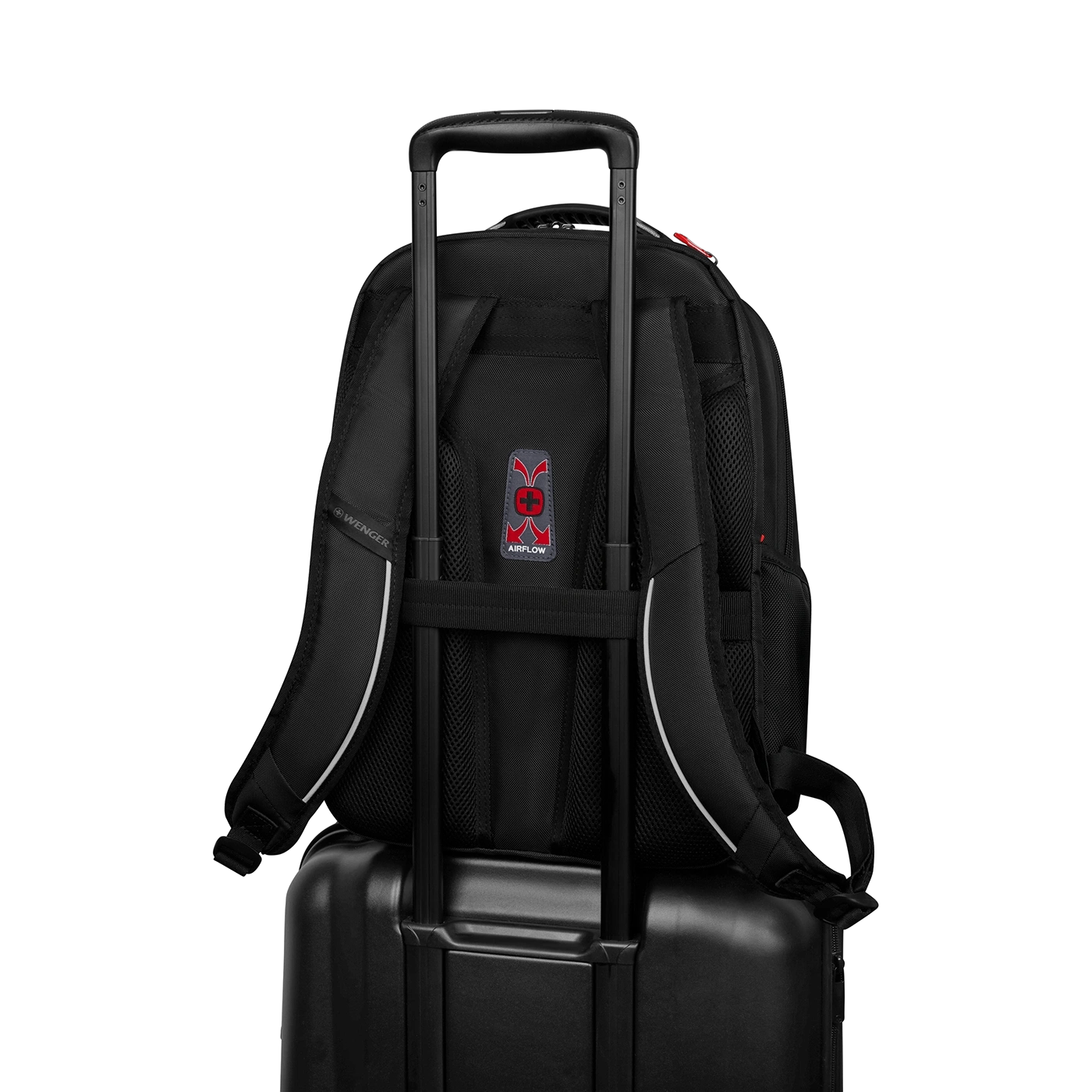 Black backpack on a suitcase with handle, Airflow logo, Wenger brand, against black background.