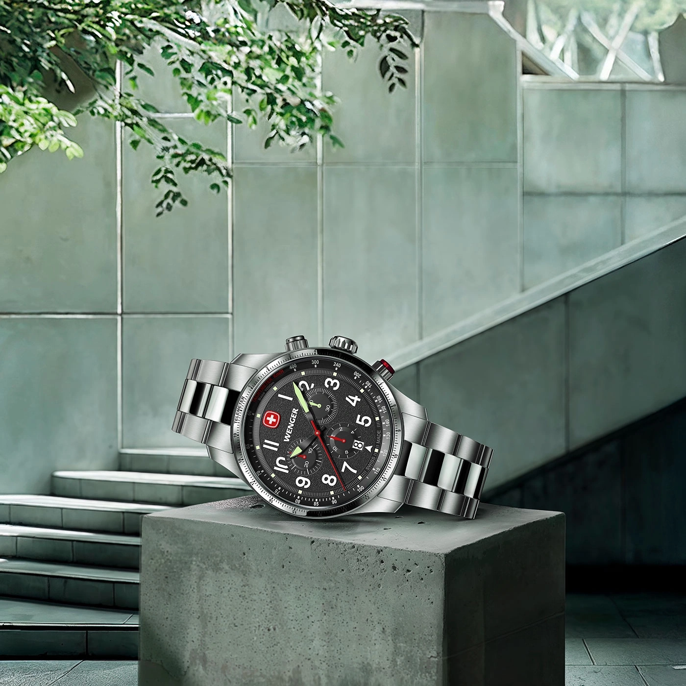 Watch on concrete block, stairs and greenery, modern design, stylish