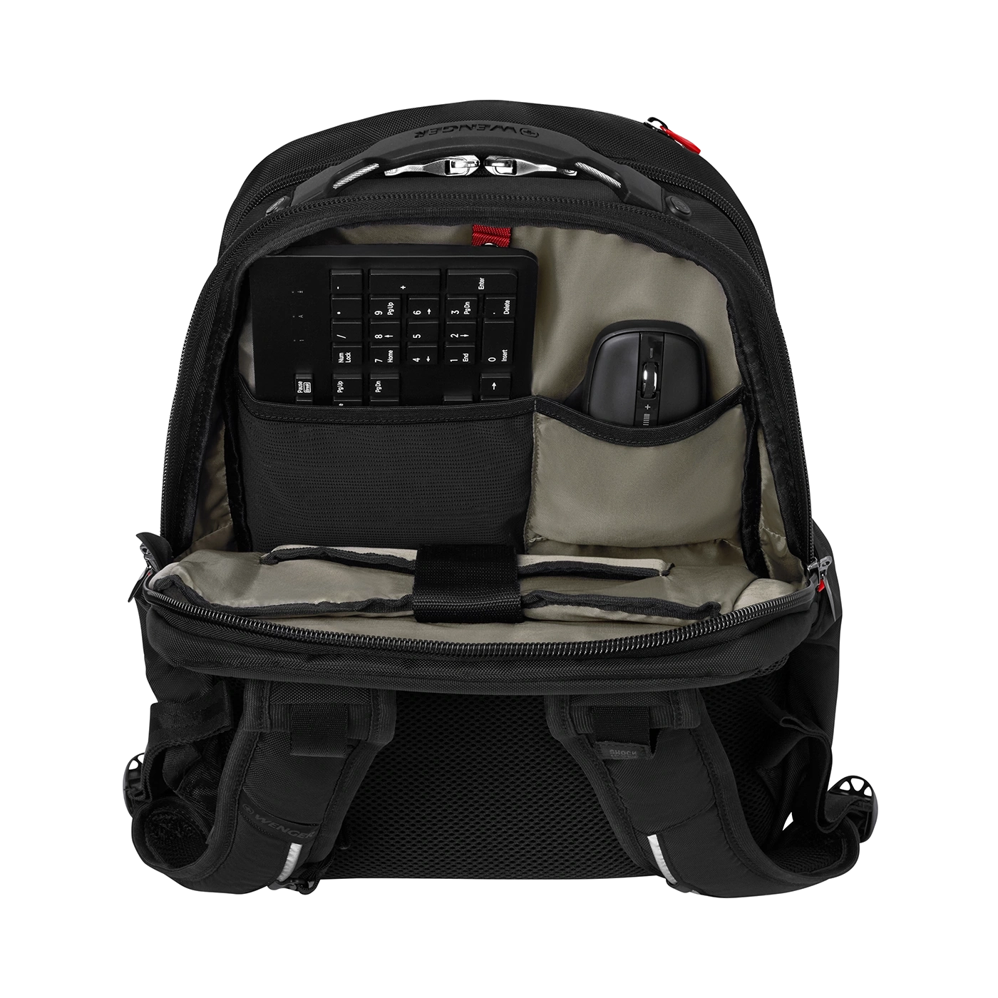 Black backpack with keyboard and mouse, open, on a black background.